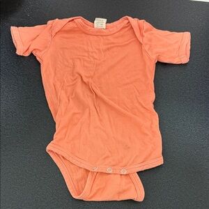 Kate Quinn Peach Baby Onesie